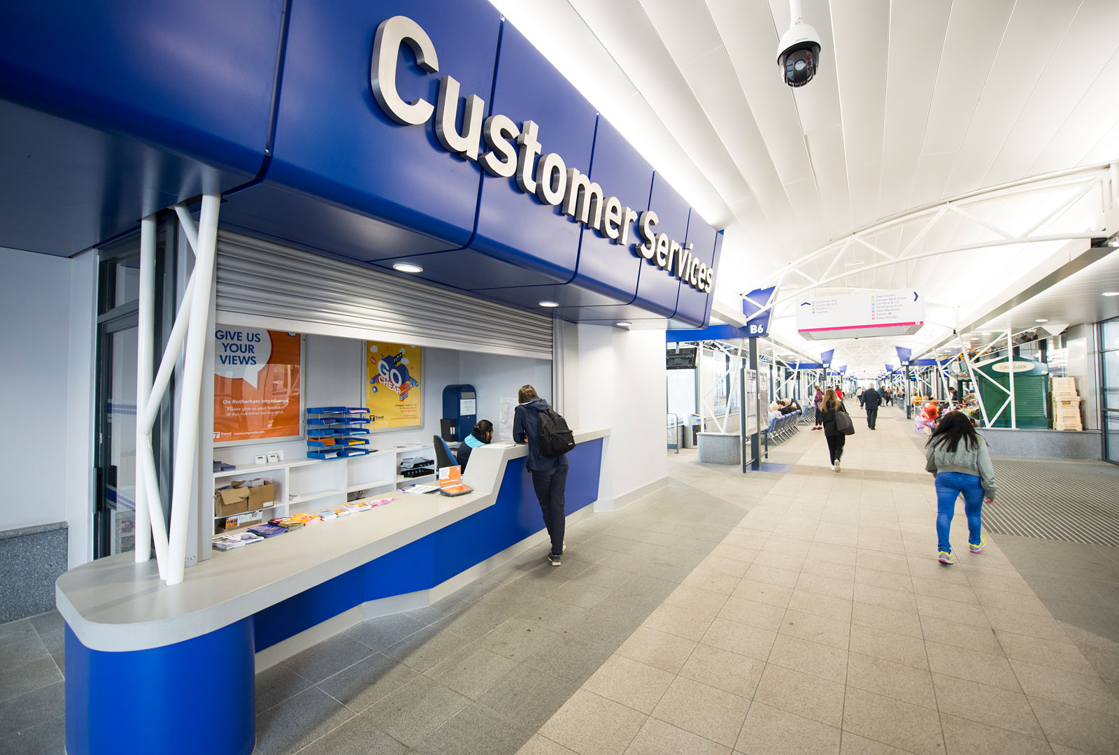 Inside of rotherham interchange showing woman stood at customer services desk