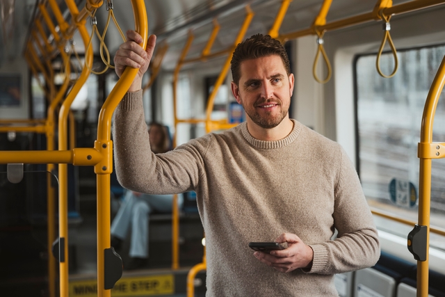 Man standing in tram